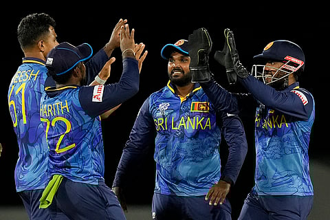 Sri Lanka's players celebrate Michael Levitt 's wicket